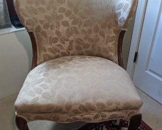 Digging this Hollywood Regency slipper chair, with its curved back and sensuous legs. 