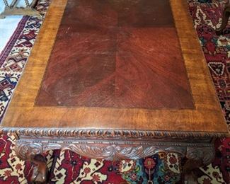 Banded/carved mahogany coffee table, with ball and claw feet.