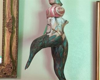 Carved wood Dancing Queen, by Abba!                               Not really, it's by someone much more famous, modern artist: Sandra Berry Hover, 1994.                                                                                        She's swinging around on her good foot on a custom metal stand.                                                                                       "Both clay and wood give me a traditional physical awareness.  Carving wood, the grain leads me organically as I seek to design the form. Molding clay pushes my hands, moving fast to shape the form with a feeling of expression. Intuition is a daring of the mind, always leading to the unknown".