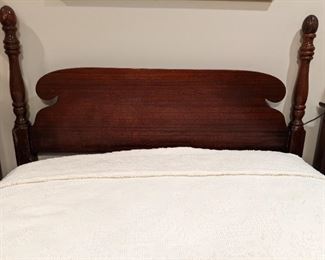 Detail of the 1940's half-poster ribbon mahogany headboard.