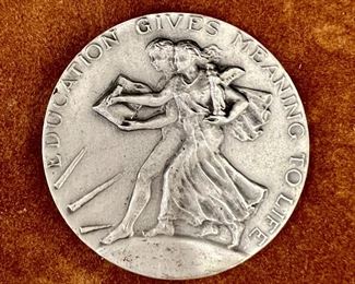 Item 33:  "Education Gives Meaning to Life" Academic Sterling Silver Medallion by Bastian Brothers - 2": $75