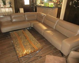 7K originally paid for Natuzzi Sectional leather sofa and matching chair. Asking $2800 NOW!  Amazing price for something so gorgeous.  We also have up for sale 2 round end tables with matching coffee table and sofa table.