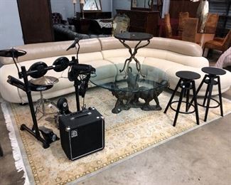 Electric drum set, leather sectional, glass top coffee table. Orlando Auction