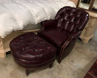 Red leather arm chair with ottoman.  Orlando Auction
