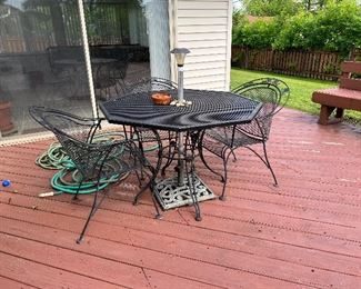 Octagon wrought-iron table and chairs. very unique.  Cast Iron Umbrella Stand.