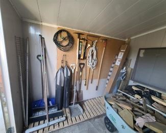 Garden Tools, Large Sweeper 2 Bag chairs, 3 Umbrella one is brand new, lumber scraps for sale, wheelbarrow, garden hose, shovels and snow shovel 