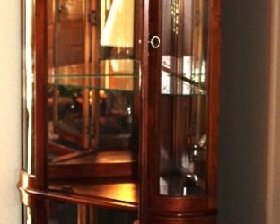 Lighted, corner, curio cabinet (solid wood).