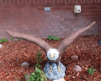 Large concrete American bald eagle.  No worries, this one is too heavy to take flight, even in Kansas.