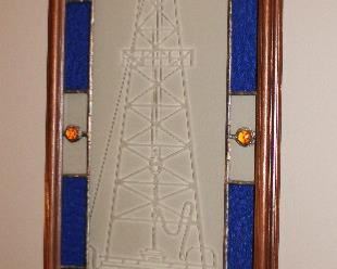 Oil derrick etched and stained glass art.