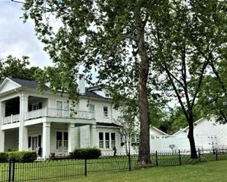 The carriage house on the east side of the home is full, too.