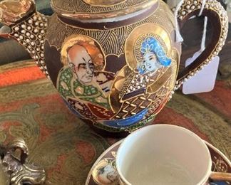 Vintage Asian teapot, cup, and saucer with gold highlights