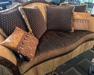 Large, plush sofa with 6 pillows