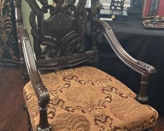 Highly carved antique arm chair
