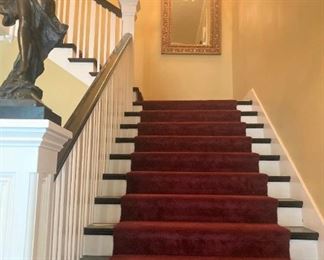 Large mirror (The stairway statue and chandelier stay with the house.) 