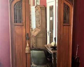 Large antique mirrored armoire