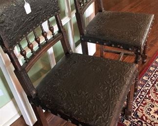 Embossed leather antique chairs