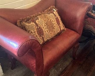 Small red leather settee
