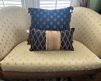 Love seat upholstered in honey bee fabric  (Bee symbolism and meanings include focus, dedication, hard work, teamwork, fertility, prosperity, and generosity. Because bees exist on every continent on Earth except Antarctica, they are subjects in the mythology and folklore of many cultures around the world.)