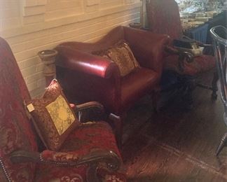 One of two lovely  dining table host chairs; red leather settee