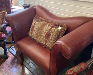 One of two lovely  dining table host chairs; red leather settee