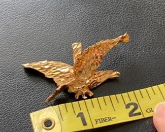 $450 - 14kt yellow gold eagle hand chased. 