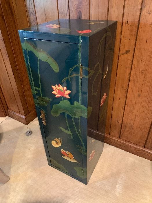 There are 2 of these tall chests with shelving inside