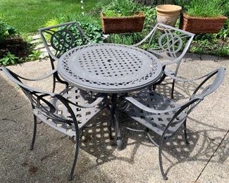 2 sets of outdoor powder-coated aluminum patio furniture. Also 2 square side tables and umbrellas with stand.