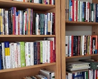 wood bookcases and lots of books