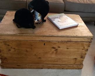 Antique wooden trunk, black velvet horse riding helmets