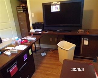 nice desk w/file cabinets, large flat screen