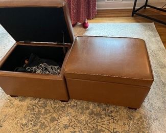 two leather storage bins 