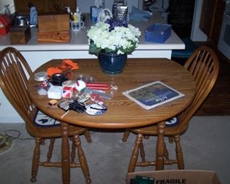 DINETTE SET ( THERE ARE EXTRA CHAIRS STORED IN THE GARAGE)