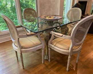 Unique Kitchen table with thick glass top and 4 Cane Back chairs