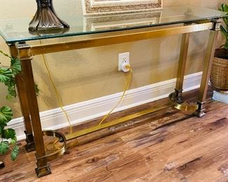 10______$150 	
Console brass frame glass top  • 52Lx 16Wx 28H