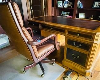 
57______$150 
Leather desk chair on casters 