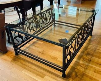 76______$250 
Iron base & glass top coffee table • 20Hx50Wx37D
