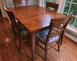 table measures 30" high x 56" wide x 38" deep with one leaf in (as shown); chairs measure 36.5" high x 21" wide x 18" deep, 4 available.