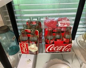 Coca Cola bottles & holders