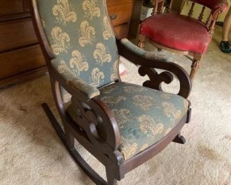 Antique rocking chair with green fabric $175