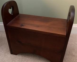 Child’s stool with heart cut out and storage