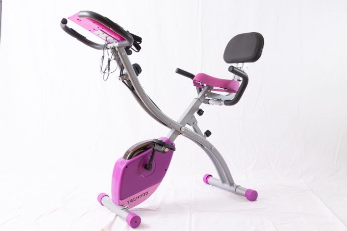 Exercise Bike with handle bars, speedometer and resistance training cables.