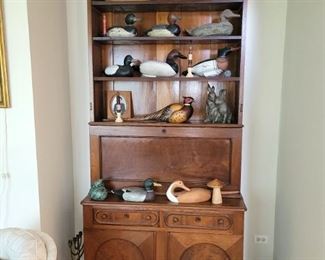 Antique cabinet. Decoys