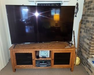 65" LG flat screen 8k TV. Solid wood high quality tv stand