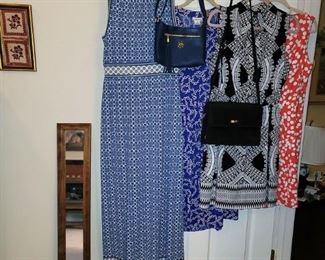 Lots of women's dresses and purses