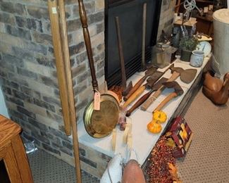 Antique bouys. antique brass bed warmer. Wood wheat flail. Antique chisels, coffee grinder, 25 lb scale  butter churners