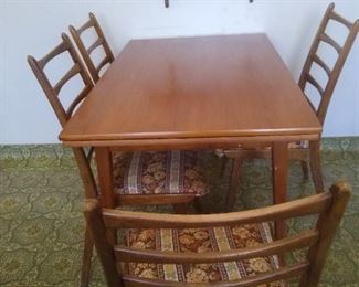Mid Century Modern hidden leaf table and 4 chairs approx 42" x 29