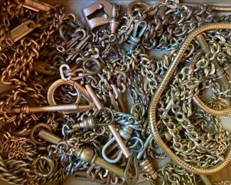 Various vintage pocket watch chains and fobs