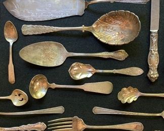 Assorted vintage silver and silver plate utensils and serving pieces