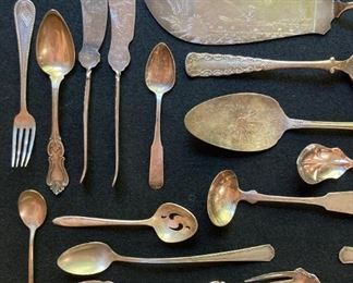 Assorted vintage silver and silver plate utensils and serving pieces