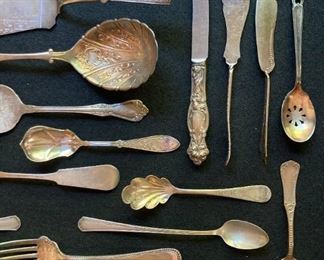 Assorted vintage silver and silver plate utensils and serving pieces